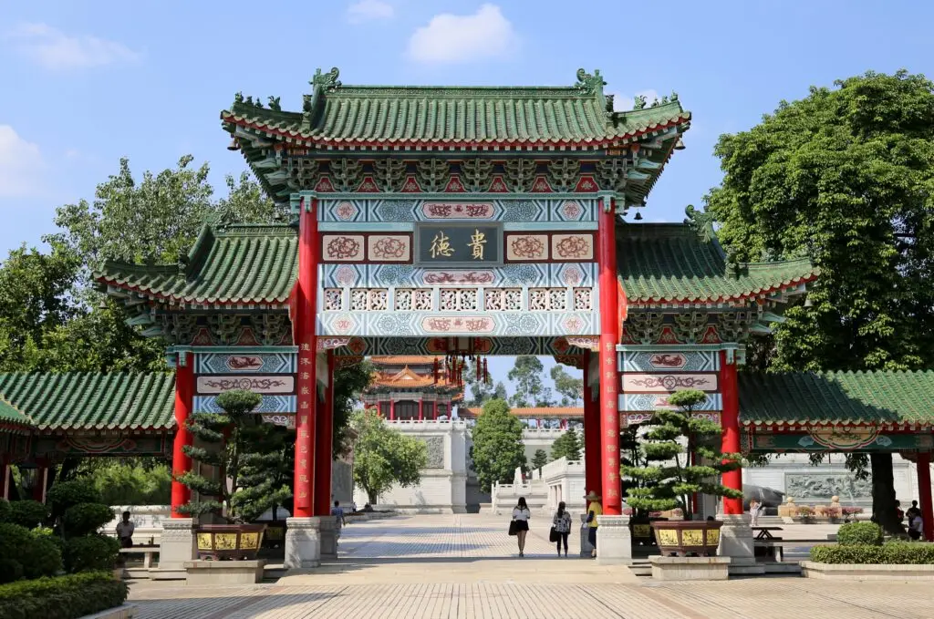 Explore the Yuanxuan Taoist Temple with its beautiful red and green traditional entrance gate in Guangzhou.